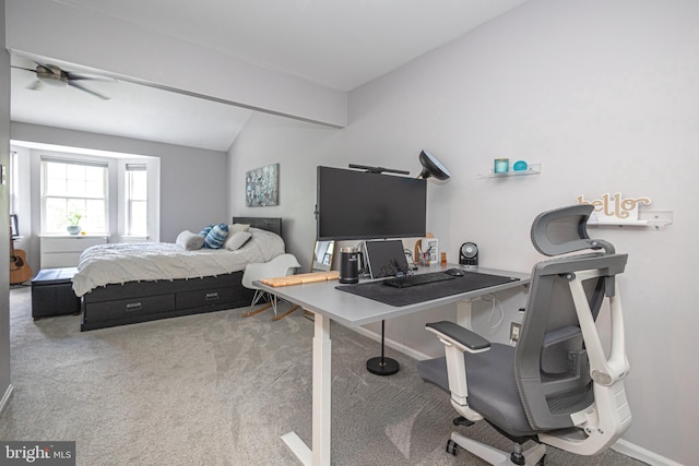 bedroom with lofted ceiling, carpet floors, and baseboards