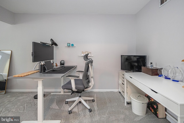office space with carpet and baseboards