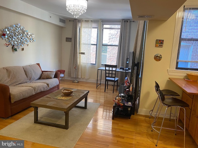 1858 California St NW Unit 33, Washington, DC 20009 - living area featuring light wood-type flooring and a chandelier