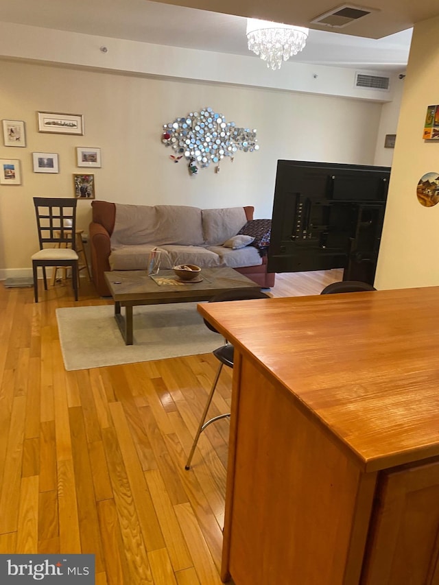 1858 California St NW Unit 33, Washington, DC 20009 - living area featuring light wood-type flooring and a chandelier