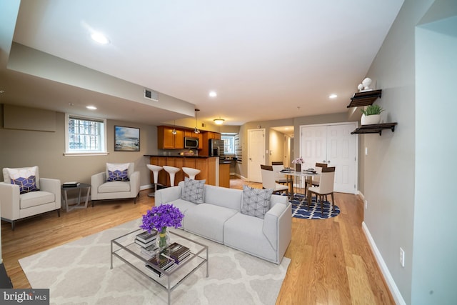 2510 Ontario Rd NW Unit 1, Washington, DC 20009 - living area featuring light wood finished floors, recessed lighting, and baseboards