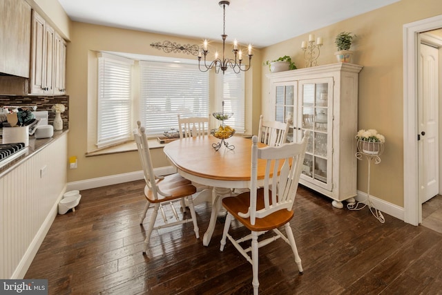 503 Dugout Dr, Lanoka Harbor, NJ 08734 - dining area with a chandelier, dark wood-type flooring, and baseboards