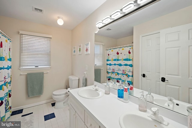 503 Dugout Dr, Lanoka Harbor, NJ 08734 - bathroom with tile patterned floors, toilet, baseboards, double vanity, and curtained shower
