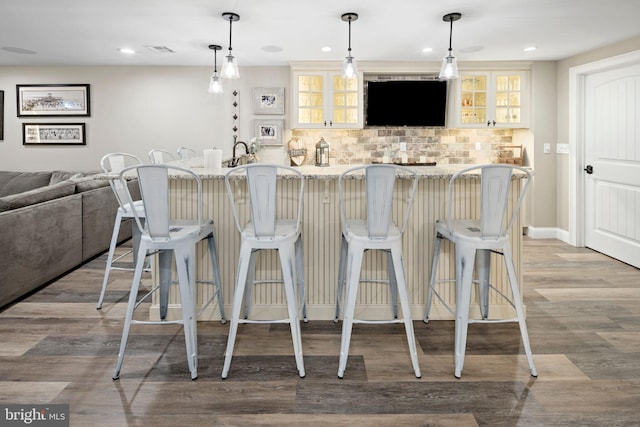 503 Dugout Dr, Lanoka Harbor, NJ 08734 - kitchen featuring decorative backsplash, open floor plan, wood finished floors, glass insert cabinets, and recessed lighting