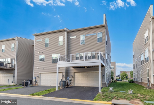 42645 Aden Ter, Ashburn, VA 20148 - back of house featuring a garage, driveway, and cooling unit
