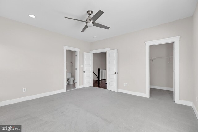 42645 Aden Ter, Ashburn, VA 20148 - unfurnished bedroom with carpet, baseboards, a walk in closet, a closet, and ensuite bath