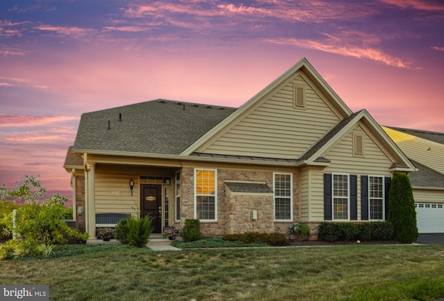 1255 Webb Dr, Perkasie, PA 18944 - view of front facade with a yard, an attached garage, roof with shingles, and stone siding