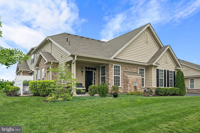 1255 Webb Dr, Perkasie, PA 18944 - view of front of house with a front lawn, roof with shingles, and stone siding