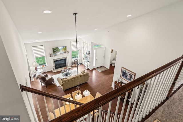 1255 Webb Dr, Perkasie, PA 18944 - living room featuring a glass covered fireplace, recessed lighting, dark wood-style floors, baseboards, and lofted ceiling