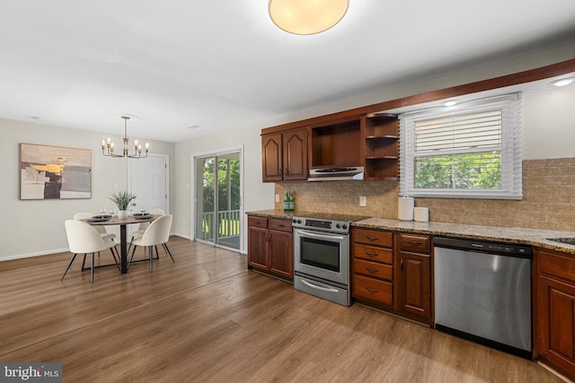 12516 Castleleigh Pl, Silver Spring, MD 20904 - kitchen featuring stainless steel appliances, under cabinet range hood, open shelves, decorative backsplash, and wood finished floors