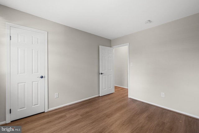 12516 Castleleigh Pl, Silver Spring, MD 20904 - unfurnished bedroom featuring wood finished floors and baseboards