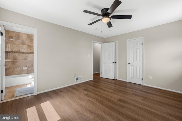 12516 Castleleigh Pl, Silver Spring, MD 20904 - unfurnished bedroom with wood finished floors, baseboards, ensuite bathroom, and two closets