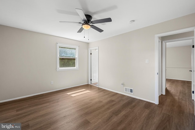 12516 Castleleigh Pl, Silver Spring, MD 20904 - unfurnished bedroom featuring dark wood finished floors, baseboards, and a ceiling fan