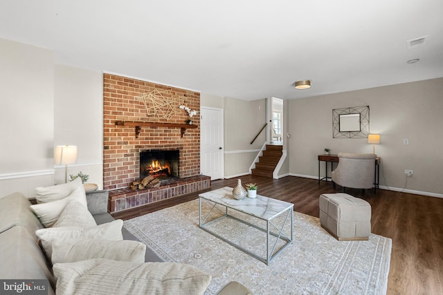 12516 Castleleigh Pl, Silver Spring, MD 20904 - living area featuring wood finished floors, stairs, and a brick fireplace