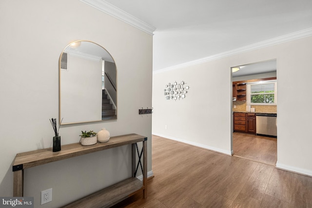 12516 Castleleigh Pl, Silver Spring, MD 20904 - hallway with crown molding, light wood-style flooring, stairway, baseboards, and arched walkways