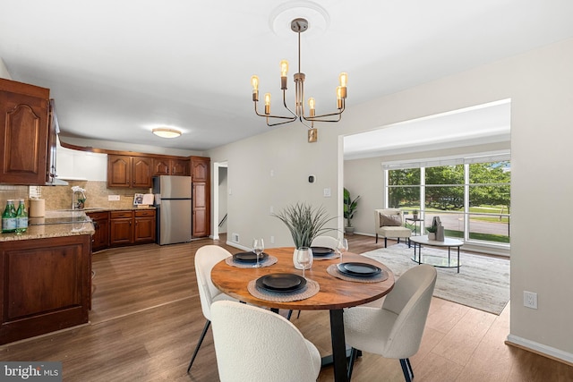 12516 Castleleigh Pl, Silver Spring, MD 20904 - dining space with a chandelier, wood finished floors, and baseboards