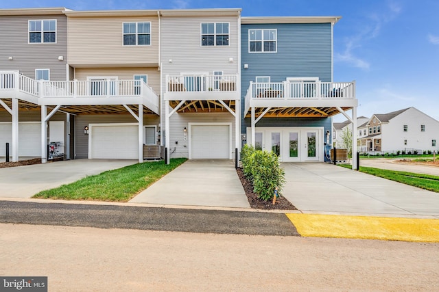311 Sandy Bottom Cir Lot 127Quincy, Ranson, WV 25438 - back of house featuring a garage, driveway, and a carport