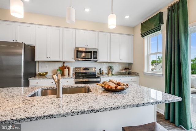 311 Sandy Bottom Cir Lot 127Quincy, Ranson, WV 25438 - kitchen with stainless steel appliances, a sink, backsplash, white cabinetry, and light stone countertops