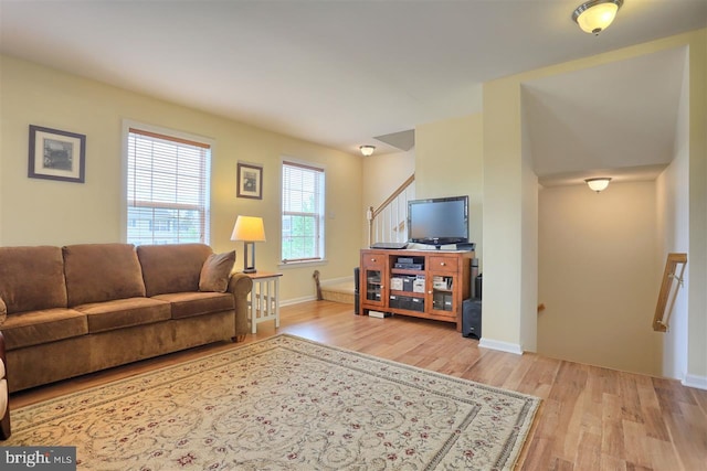113 Westpoint Dr, Carlisle, PA 17013 - living room with light wood-type flooring, baseboards, and stairway