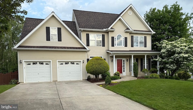 2411 Windwood Dr, Winchester, VA 22601 - traditional home featuring concrete driveway, a garage, a shingled roof, and a porch
