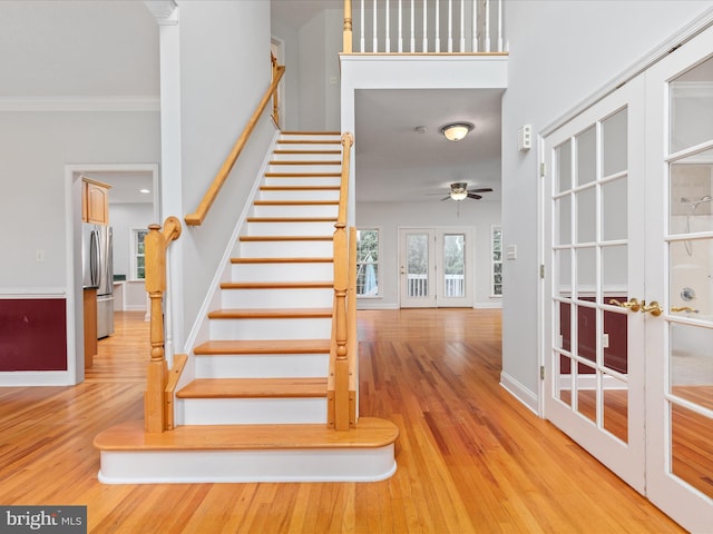 2411 Windwood Dr, Winchester, VA 22601 - staircase with wood finished floors, ornamental molding, a ceiling fan, and baseboards
