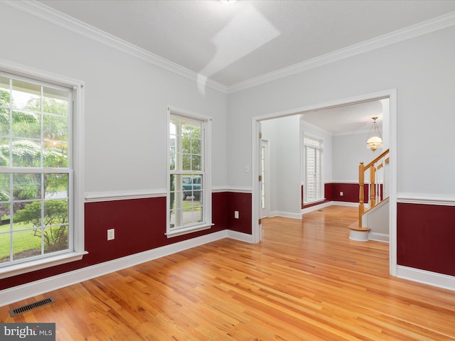 2411 Windwood Dr, Winchester, VA 22601 - unfurnished room with light wood-style floors, ornamental molding, baseboards, stairway, and a chandelier