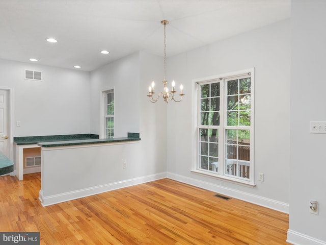 2411 Windwood Dr, Winchester, VA 22601 - spare room with light wood finished floors, baseboards, a chandelier, and recessed lighting
