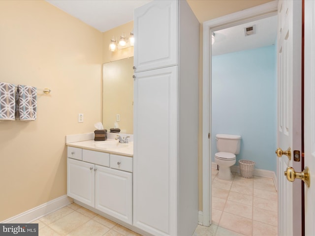 2411 Windwood Dr, Winchester, VA 22601 - bathroom with vanity, tile patterned flooring, baseboards, and toilet