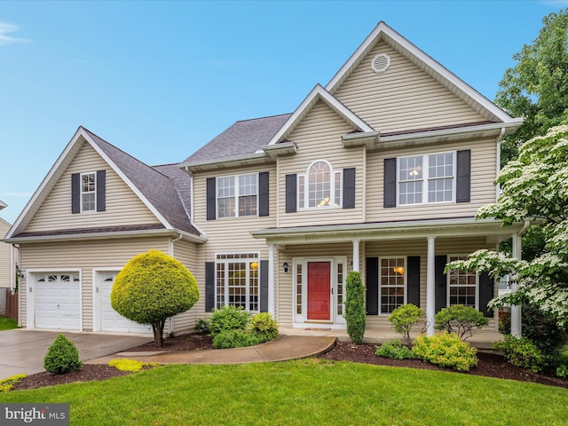2411 Windwood Dr, Winchester, VA 22601 - view of front of property featuring concrete driveway, a porch, a front lawn, and a garage