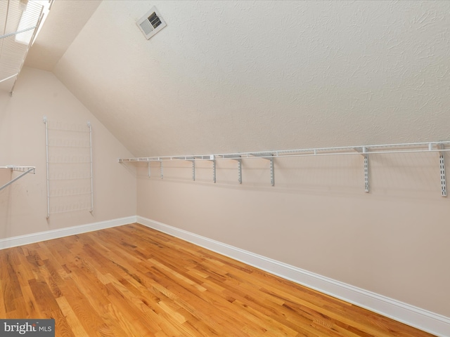2411 Windwood Dr, Winchester, VA 22601 - walk in closet with light wood-type flooring and lofted ceiling