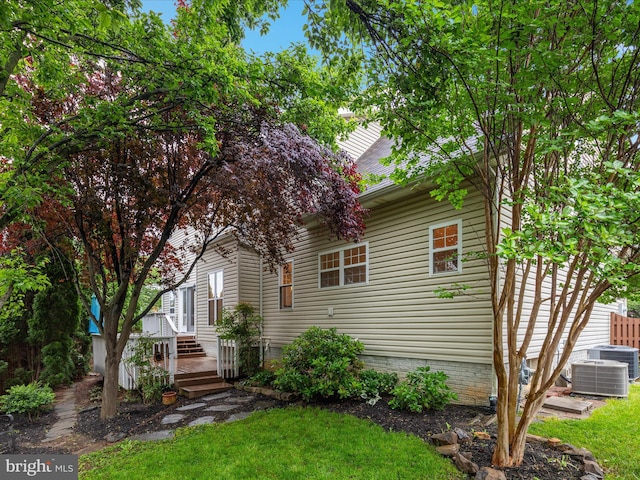 2411 Windwood Dr, Winchester, VA 22601 - view of property hidden behind natural elements featuring central air condition unit and a front yard