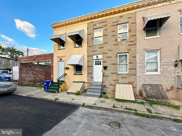 1215 N Spring St, Baltimore, MD 21213 - view of property featuring entry steps and stone siding