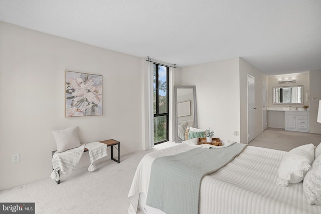 5300 Holmes Run Pkwy Unit 403, Alexandria, VA 22304 - bedroom featuring light colored carpet and ensuite bathroom