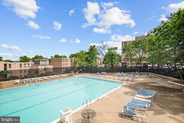 5300 Holmes Run Pkwy Unit 403, Alexandria, VA 22304 - community pool featuring a patio area