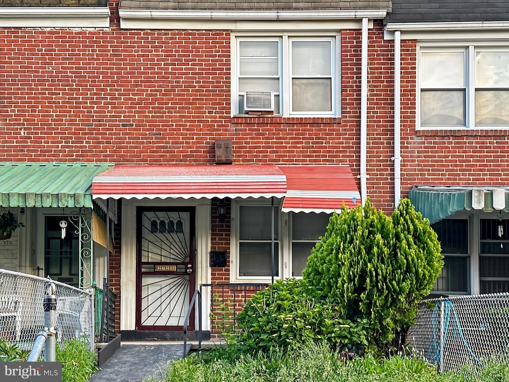 2709 E Hoffman St, Baltimore, MD 21213 - doorway to property with brick siding and cooling unit