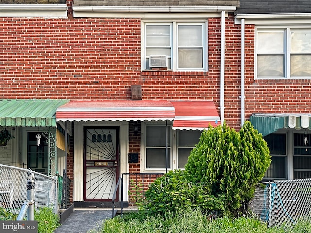 2709 E Hoffman St, Baltimore, MD 21213 - doorway to property with brick siding and cooling unit