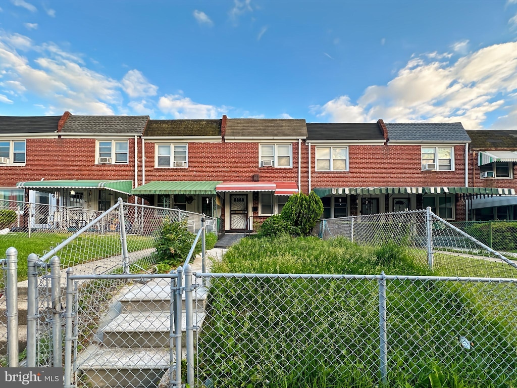 2709 E Hoffman St, Baltimore, MD 21213 - view of property with a gate and brick siding