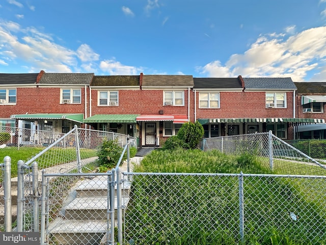 2709 E Hoffman St, Baltimore, MD 21213 - view of property with a gate and brick siding