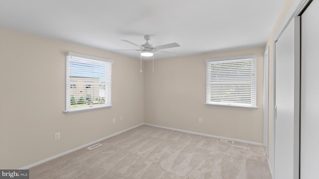 632 Towne Center Dr, Joppa, MD 21085 - unfurnished bedroom featuring light colored carpet, baseboards, a closet, and ceiling fan