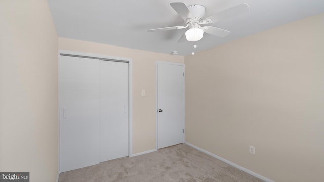 632 Towne Center Dr, Joppa, MD 21085 - unfurnished bedroom featuring light colored carpet, a closet, baseboards, and ceiling fan