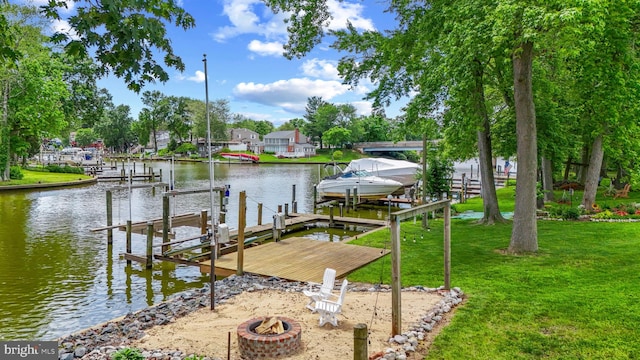 632 Towne Center Dr, Joppa, MD 21085 - dock area featuring boat lift, an outdoor fire pit, a water view, and a yard
