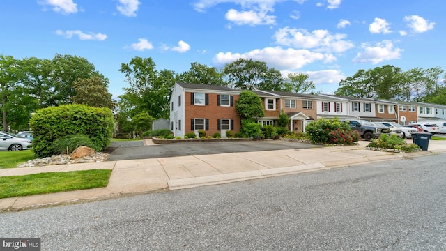 632 Towne Center Dr, Joppa, MD 21085 - view of property featuring a residential view, uncovered parking, and brick siding
