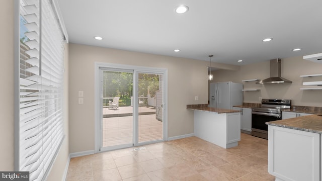 632 Towne Center Dr, Joppa, MD 21085 - kitchen with stainless steel electric range, wall chimney exhaust hood, white fridge with ice dispenser, a peninsula, and dark stone countertops