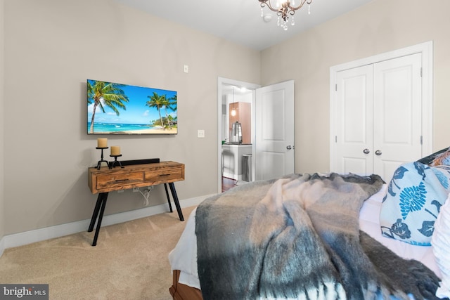 4701 Old Soper Rd Unit 565, Suitland, MD 20746 - bedroom with carpet flooring, a chandelier, baseboards, and a closet