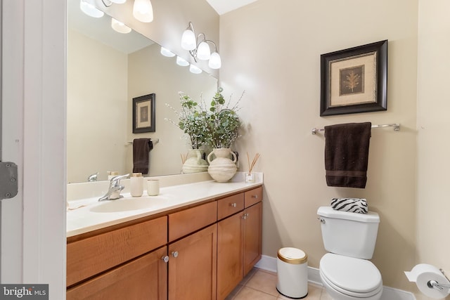 4701 Old Soper Rd Unit 565, Suitland, MD 20746 - half bathroom featuring toilet, vanity, tile patterned flooring, and baseboards