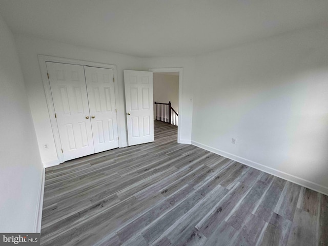 6325 Powder Flask Ct, Centreville, VA 20121 - unfurnished bedroom featuring wood finished floors, a closet, and baseboards