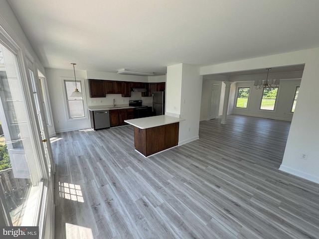 6325 Powder Flask Ct, Centreville, VA 20121 - kitchen with black appliances, a sink, open floor plan, light countertops, and baseboards
