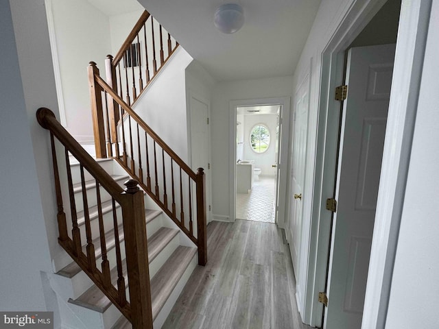 6325 Powder Flask Ct, Centreville, VA 20121 - foyer entrance with light wood-type flooring, stairs, and baseboards