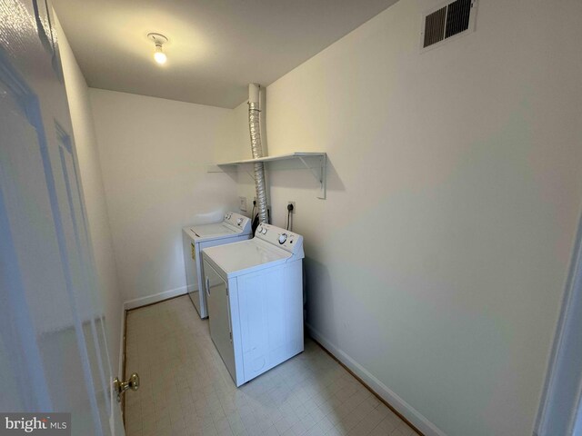 6325 Powder Flask Ct, Centreville, VA 20121 - laundry room featuring independent washer and dryer, baseboards, and light flooring
