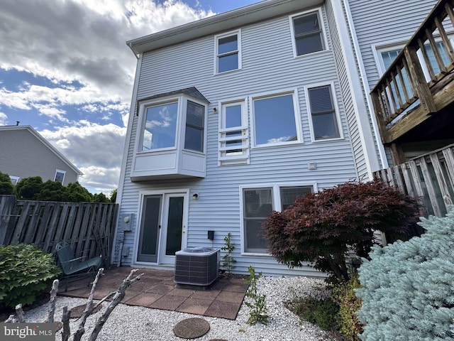 6325 Powder Flask Ct, Centreville, VA 20121 - rear view of house with central air condition unit and a patio